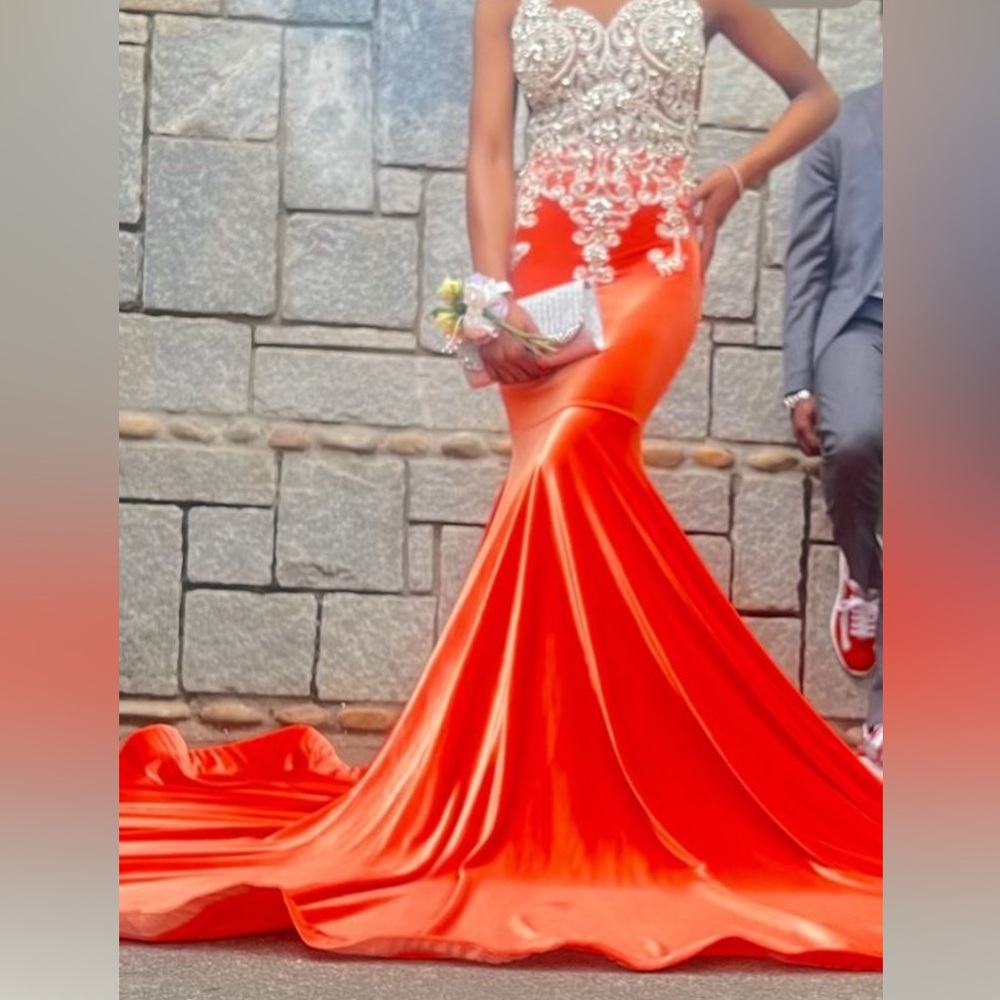 Velvet Orange Dress.,Stretchy Material. Can fit up to a Size 2 . Dry Clean done.